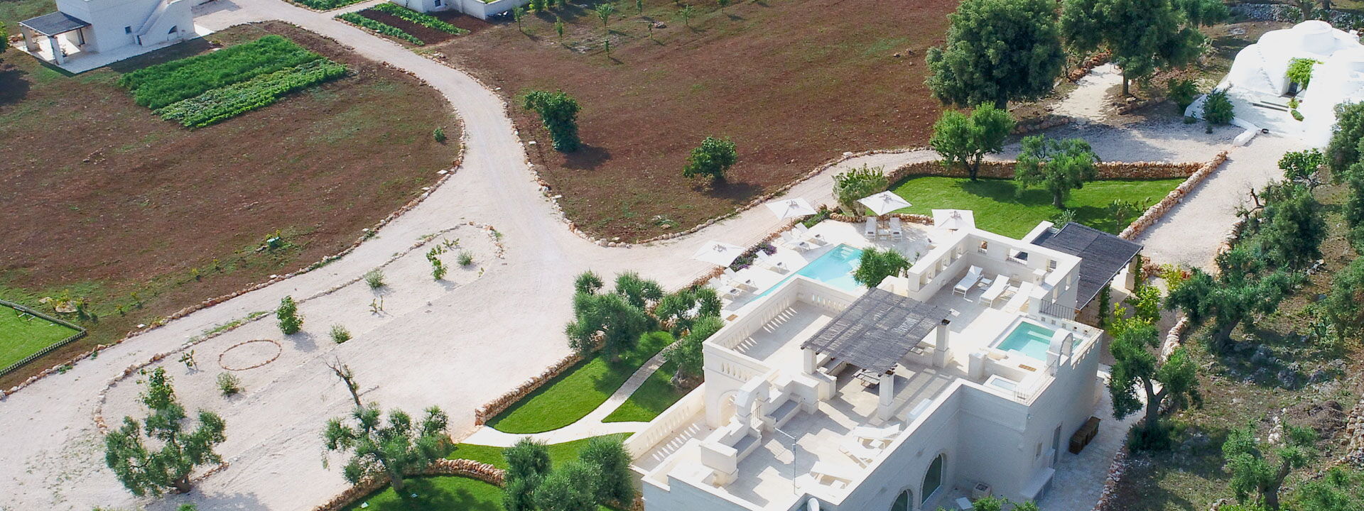 Corte Dei Messapi | Sleeps 24: Balcony / Terrace / Patio, Building Exterior, Garden, Main Entrance, Outdoor, Pool, Scenic View, Spring, Summer